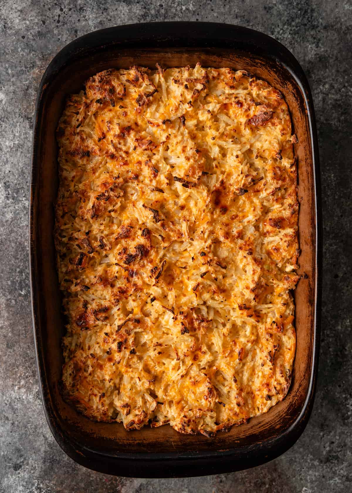 overhead: hashbrown casserole in a casserole dish after baking