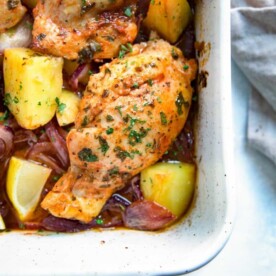 For this Spanish Chicken boneless thighs are simply seasoned with smoked paprika and lemon juice, slow roasted with red onions, garlic and potatoes for a rustic dish for a simple and rustic dish that delivers big on flavor with minimal effort. keviniscooking.com