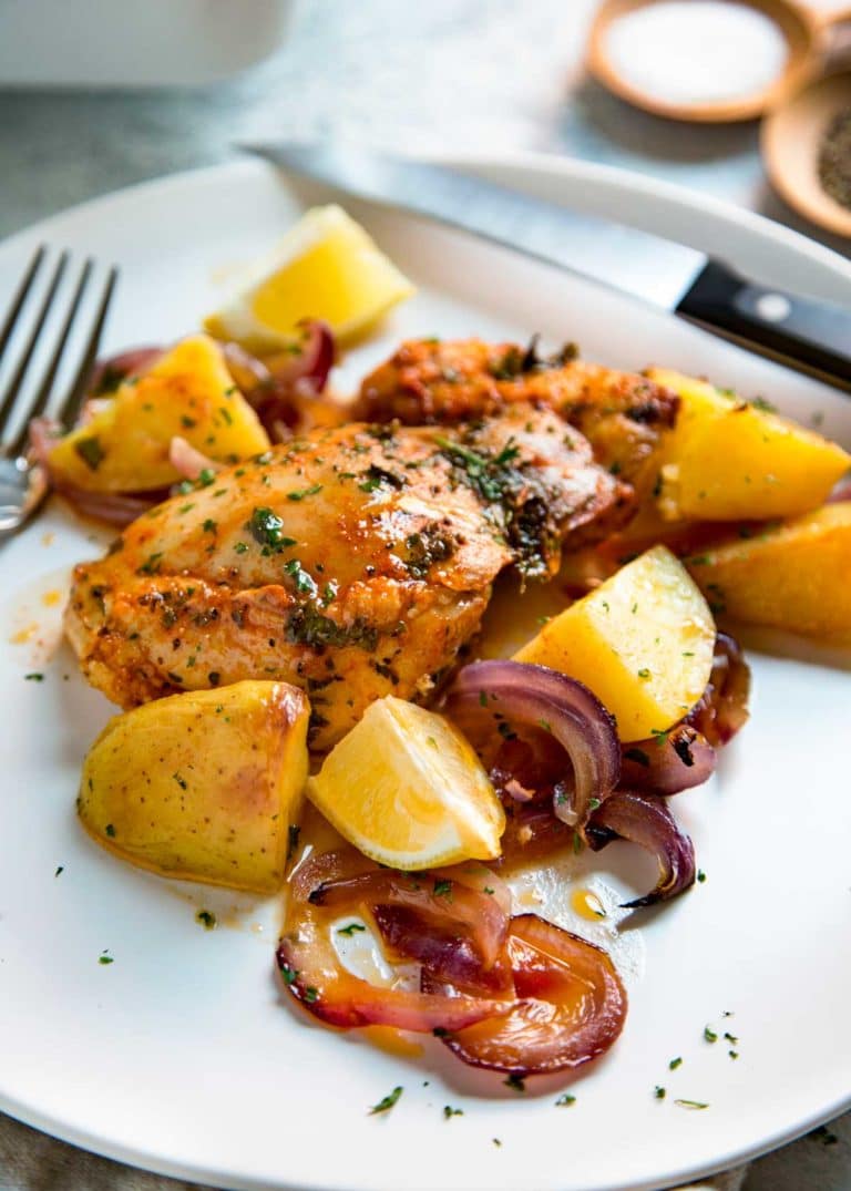 This Spanish Roasted Chicken and Potatoes is a one pan, super easy mid-week dinner for the family. Chicken thighs are seasoned with smoked paprika and lemon juice, slow roasted with red onions, garlic and potatoes and sherry. 