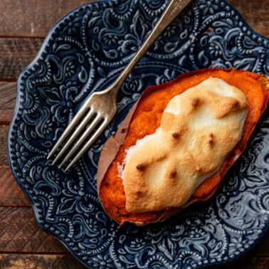 close up of Stuffed Sweet potato on blue plate