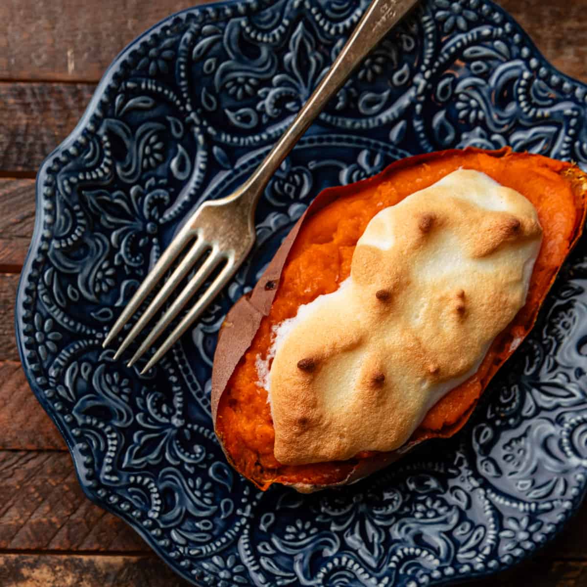 overhead closeup: stuffed sweet potato on blue plate