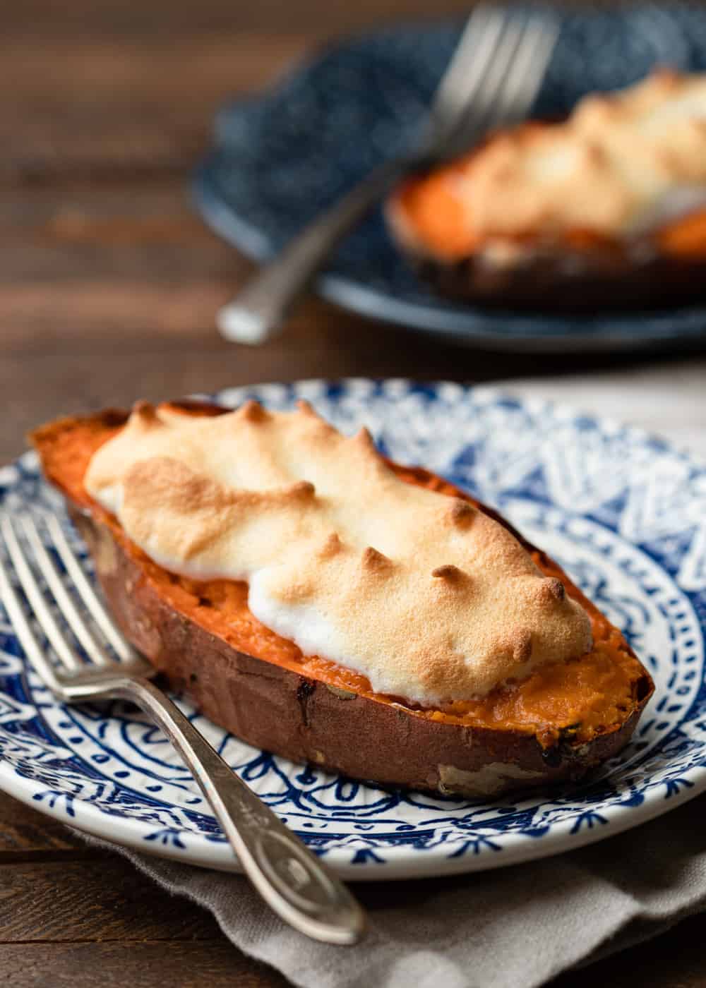 side view closeup: stuffed sweet potatoes recipe with meringue on plate