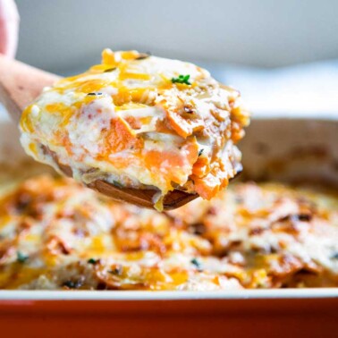 close up of sweet potatoes au gratin on serving spatula