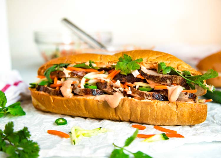 Teriyaki Pork Bahn Mi Sandwich has sliced, glazed pork tenderloin layered with pickled vegetables and herbs for a perfect lunch, party or Game Day favorite. keviniscooking.com