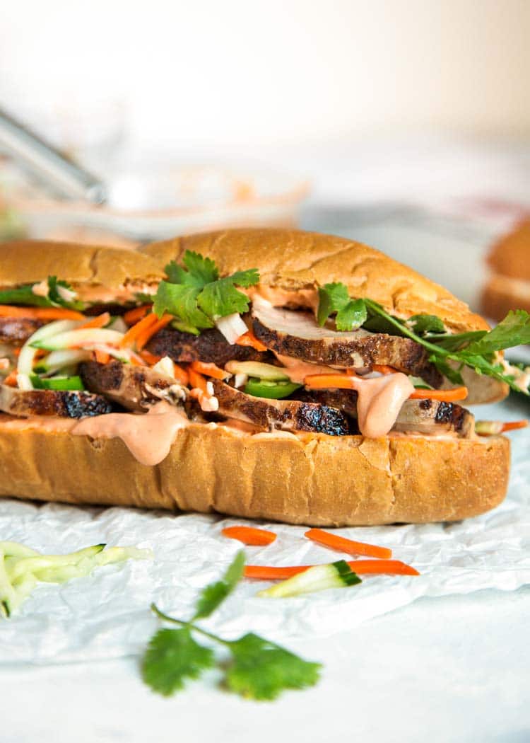 Teriyaki Pork Bahn Mi Sandwich has sliced, glazed pork tenderloin layered with pickled vegetables and herbs for a perfect lunch, party or Game Day favorite. keviniscooking.com