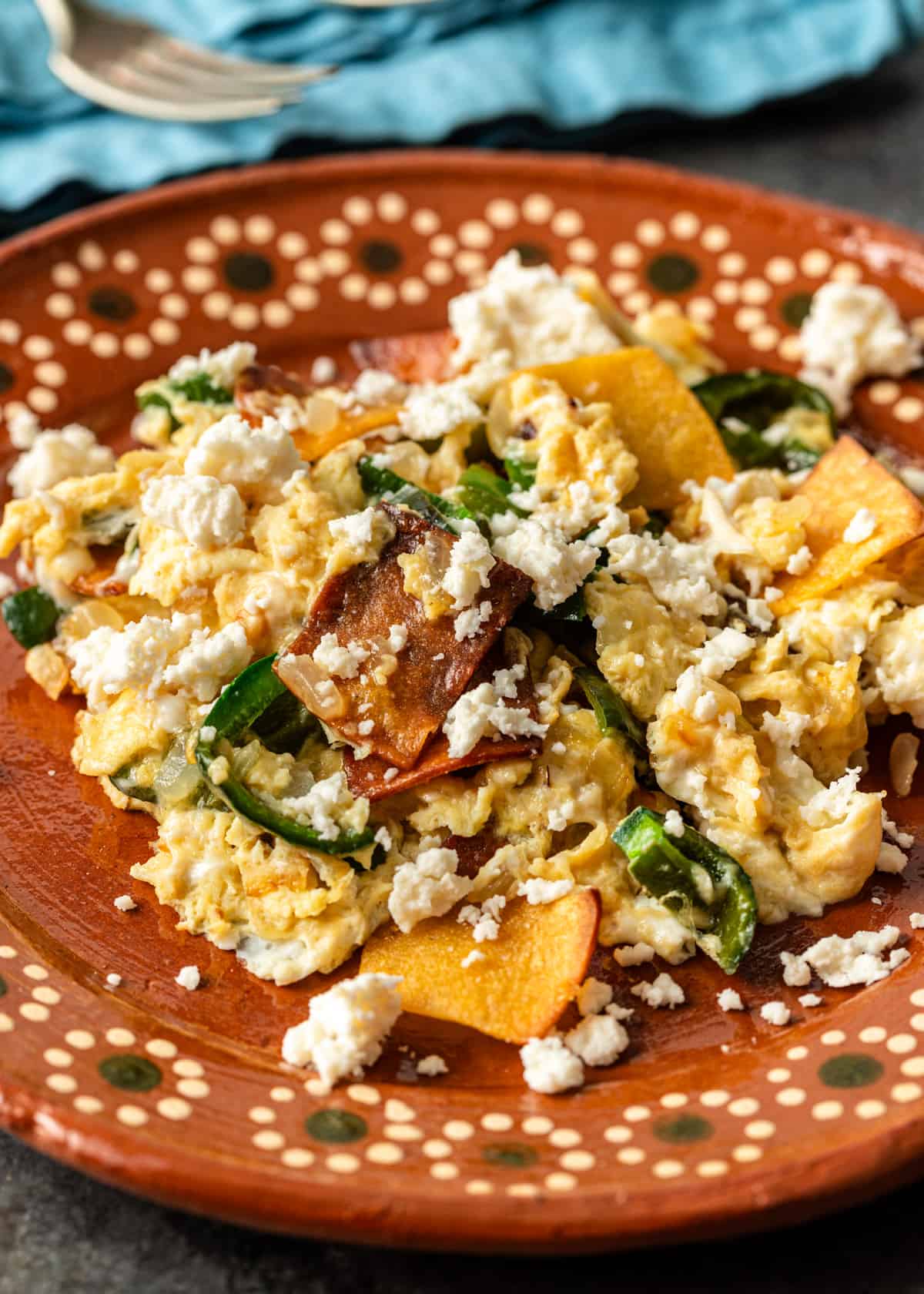 migas recipe on a ceramic plate with cheese on top