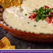 titled image: bowl of white cheese dip with diced jalapeno and tomato garnish