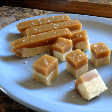A plate of food with a slice cut out, with Caramel and Shortbread